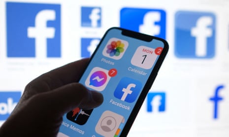 This file photo illustration photo shows a Facebook App logo displayed on a smartphone in Los Angeles, March 1, 2021.