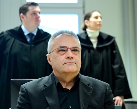 Former Austrian intelligence official Egisto Ott sits with his lawyers Anna Mair and Michael Ofner (L) behind him in the courtroom at the start of his tria in Vienna in January 2026