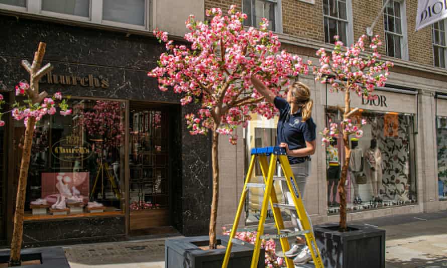 New cherry blossom trees in New Bond Street, London, as shops prepare to reopen.