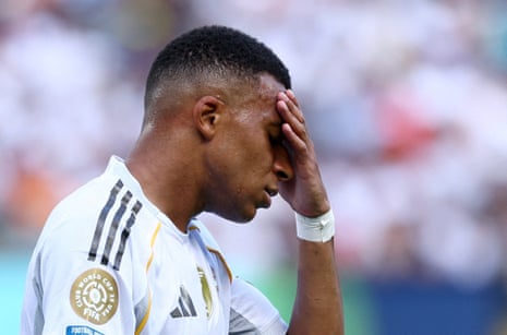 Real Madrid's Kylian Mbappe looks dejected.