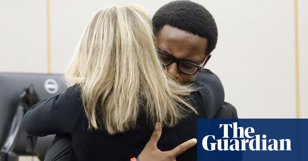 Amber Guyger: ex-officer sentenced as murdered man's brother urges healing