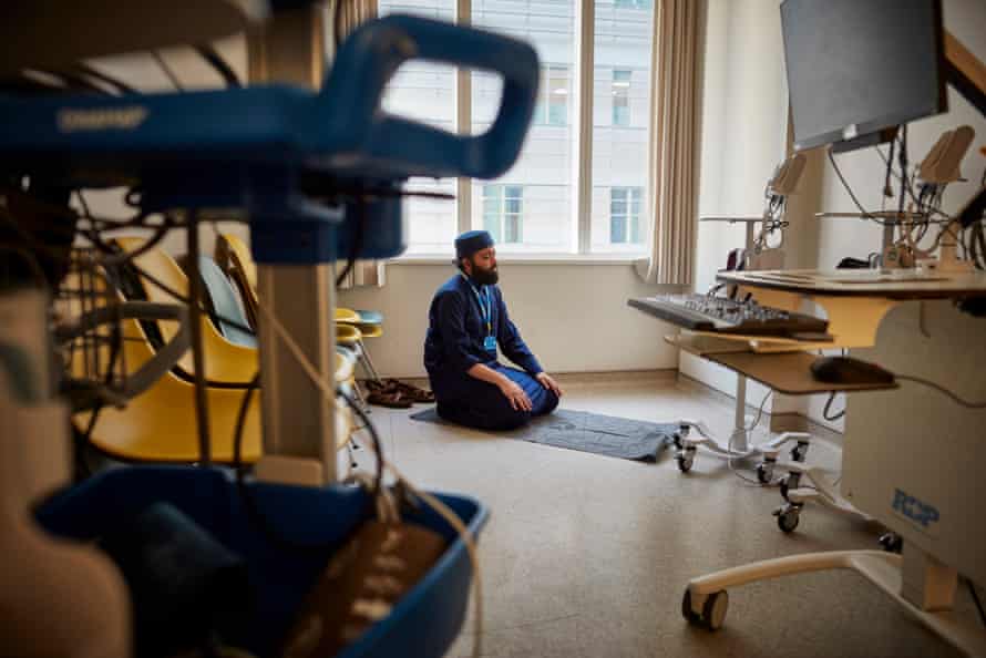 20 May: Imam Faruq Siddiqi, the Muslim chaplain for the Royal London hospital in east London, prays in an empty consulting room during Ramadan.
