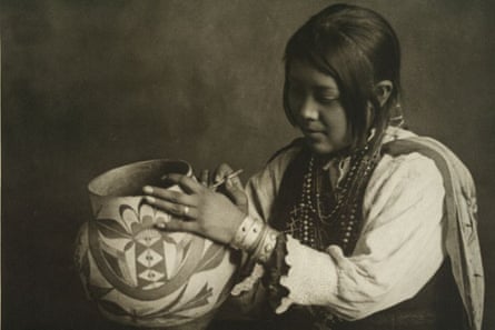 The Hopi artist Nampeyo holds one of her works of pottery.