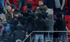 AZ Alkmaar fans and family of players of West Ham fight after the Europa Conference League semi-final second leg.