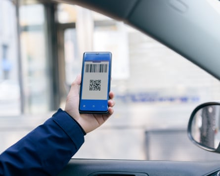 A young person pass a parking fee with smartphone