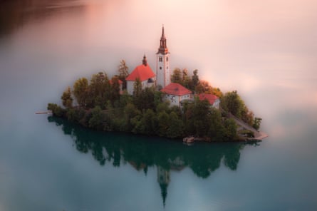 Picturesque church on an island in tranquil lake