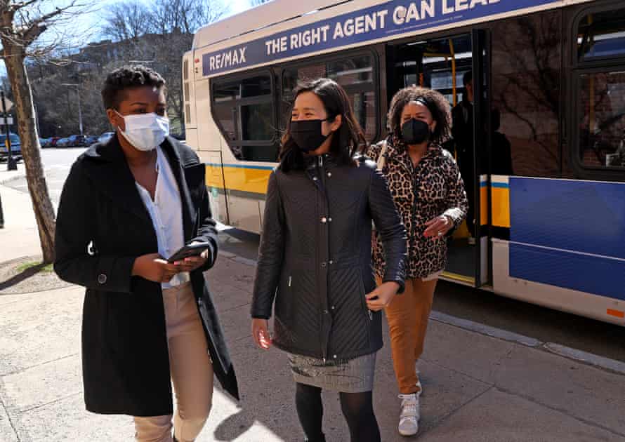 Michelle Wu, center, at an event introducing the fare-free bus pilot in Roxbury.