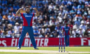 Gulbadin Naib of Afghanistan celebrates after taking the wicket of Mohammed Shami.