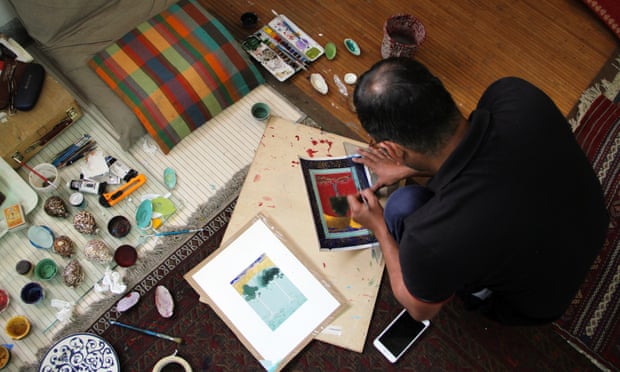 Qureshi at work on paintings for his exhibition Where the Shadows Are So Deep.