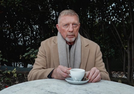 Boris Becker posing with a cup of coffee