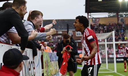 Caleb Watts celebrates with supporters after scoring what proved to be Exeter’s winner against Cheltenham earlier this month