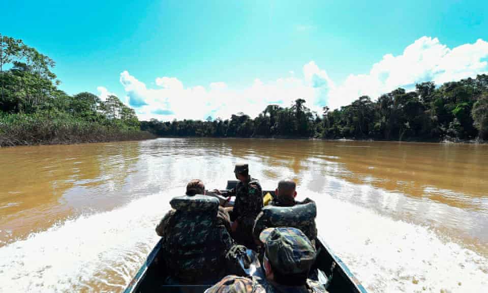 Medical personnel of the Brazilian army on a boat along the Javari River.