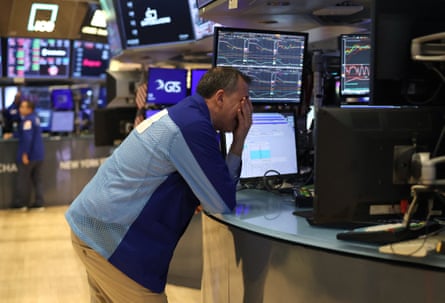 Despair in the New York stock exchange as the value of shares plunges.