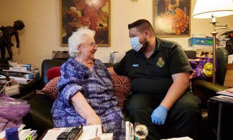 Paramedic Gerry Healey consoles Marisa, 85 whose husband Ronnie is very ill at home, as part of a 999 callout.