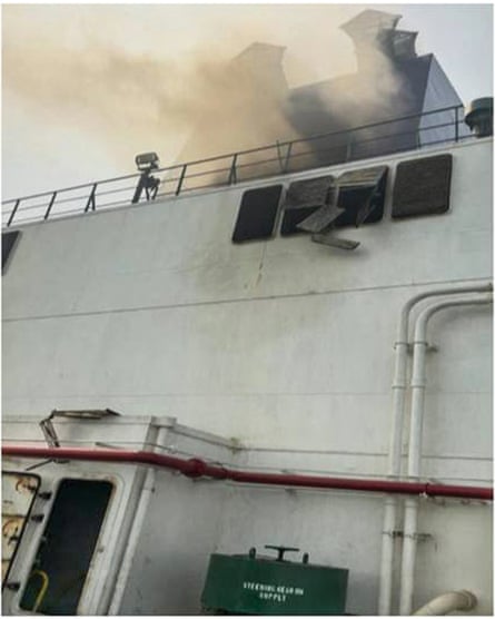 Smoke coming from the side of a ship
