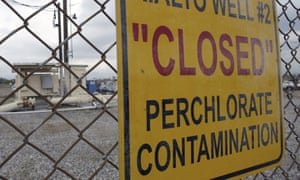 A sign posted outside a water well indicates perchlorate contamination at the site in Rialto, California.