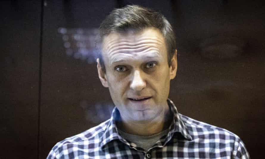 Russian opposition leader Alexei Navalny looks at photographers standing in the Babuskinsky District Court in Moscow, Russia, Saturday, Feb. 20, 2021. Jailed Russian opposition leader Alexey Navalny threw a bombshell Wednesday April 20, 2022 into France’s tight and tense presidential election campaign, alleging that Russian leader Vladimir Putin may have bought off French far-right candidate Marine Le Pen with a bank loan. Navalny offered no proof of his allegation, and made it clear he supports incumbent Emmanuel Macron. (AP Photo/Alexander Zemlianichenko, File)