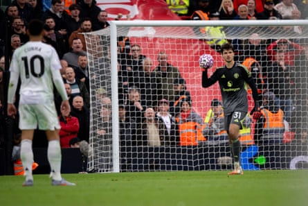 Senne Lammens holds the ball at Anfield