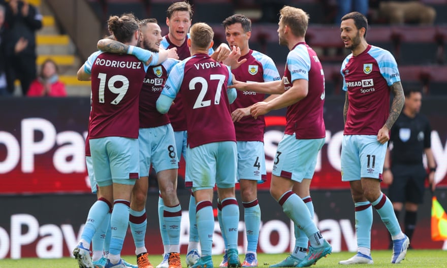 Matej Vydra is mobbed by his Burnley teammates after scoring against Wolves.