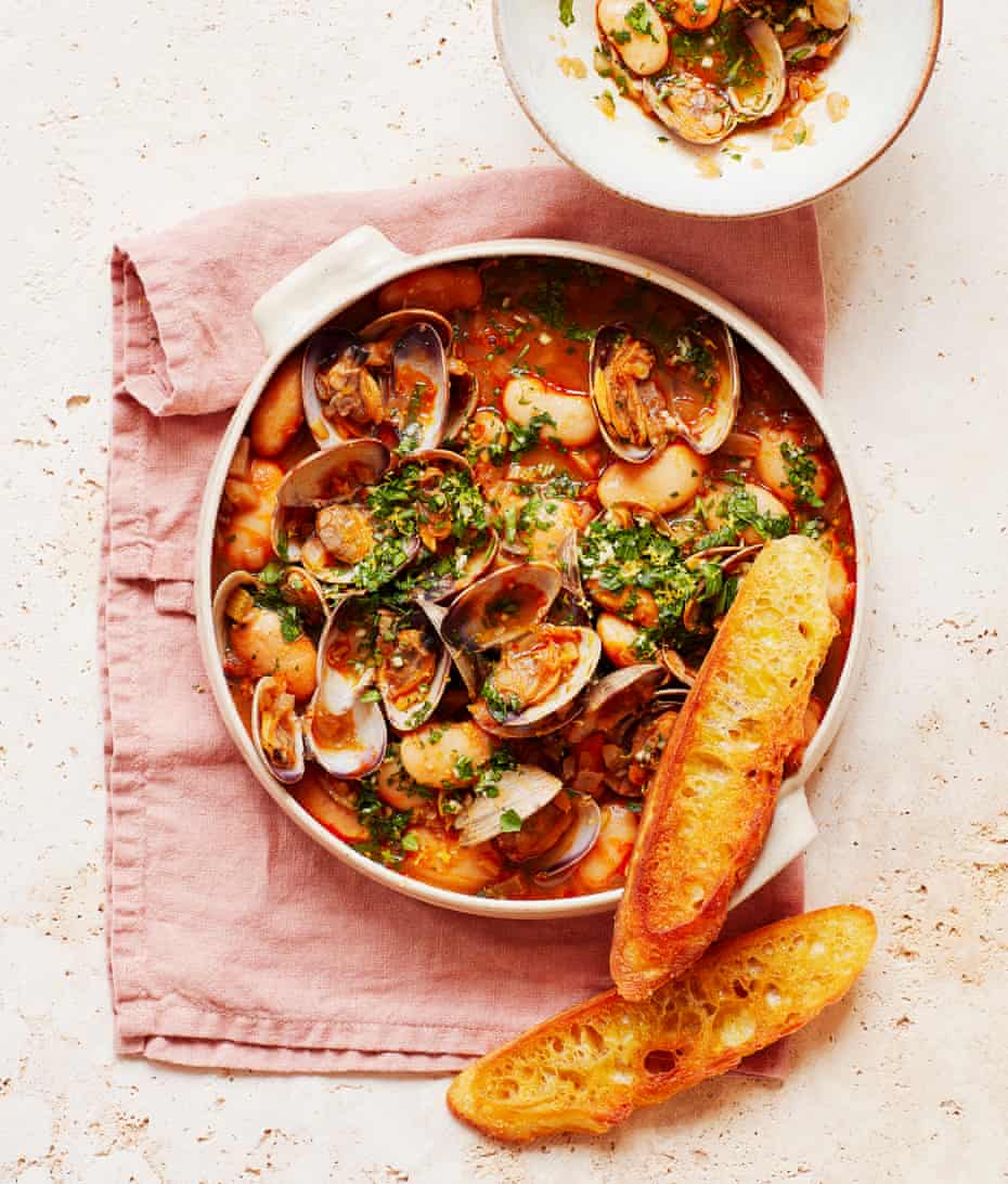 Thomasina Miers' smoky clams and butter beans with parsley gremolata and fried bread.