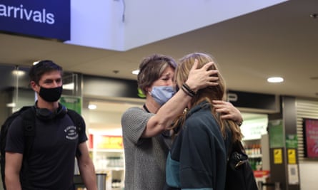 Mother and daughter Terry Kraettly and her daughter Alisha Kraettly hug as they are reunited at Auckland Domestic Airport