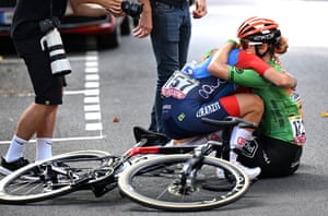French riders Dilyxine Miermont and Alison Avoine embrace at the end of the mountainous stage six