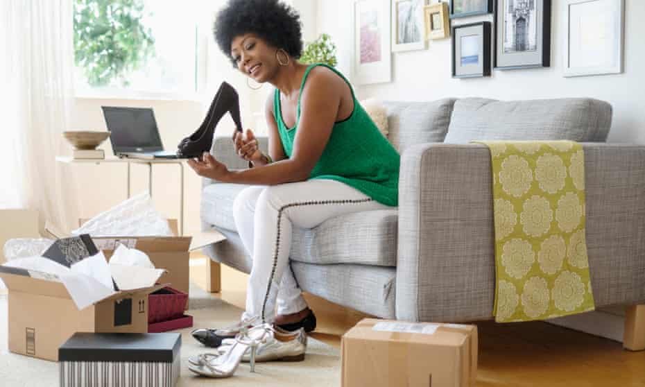 Woman opens boxes of shoes bought online
