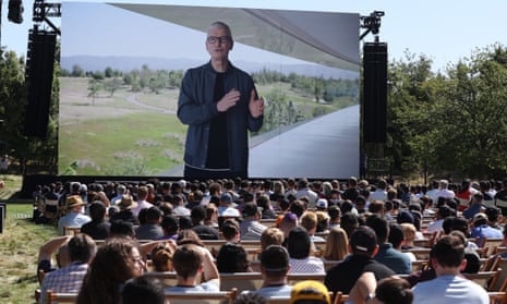 Apple CEO Tim Cook appears on a video screen as he delivers a keynote address during the company’s worldwide developer conference in Apple Park, Cupertino, California. 