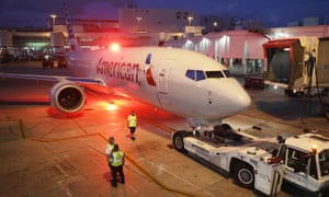 A grounded American Airlines 737 Max 8 under tow at Miami airport.