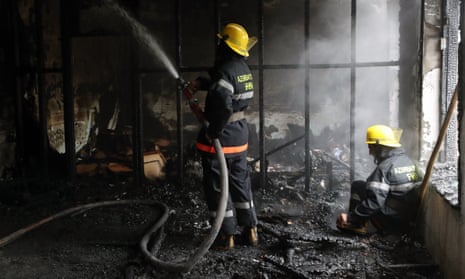 Firefighters in Barda, Azerbaijan, tackle a blaze at a residential building damaged by shelling