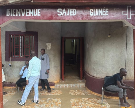 Men outside SAJED-Guinée