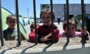 Children inside a camp for refugees and migrants in an abandoned factory in Thessaloniki.