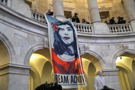 Immigration activists protest inside the rotunda of the Russell Senate office building on 7 February.