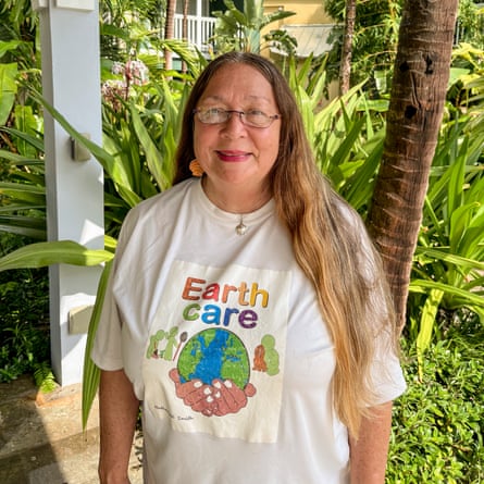 A woman in an Earthcare T-shirt
