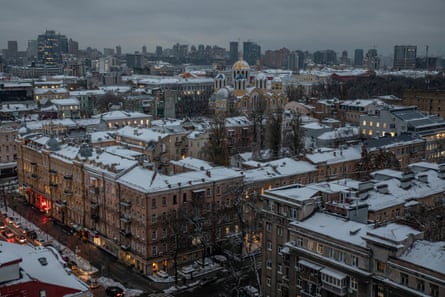 Snow-covered buildings in Kyiv