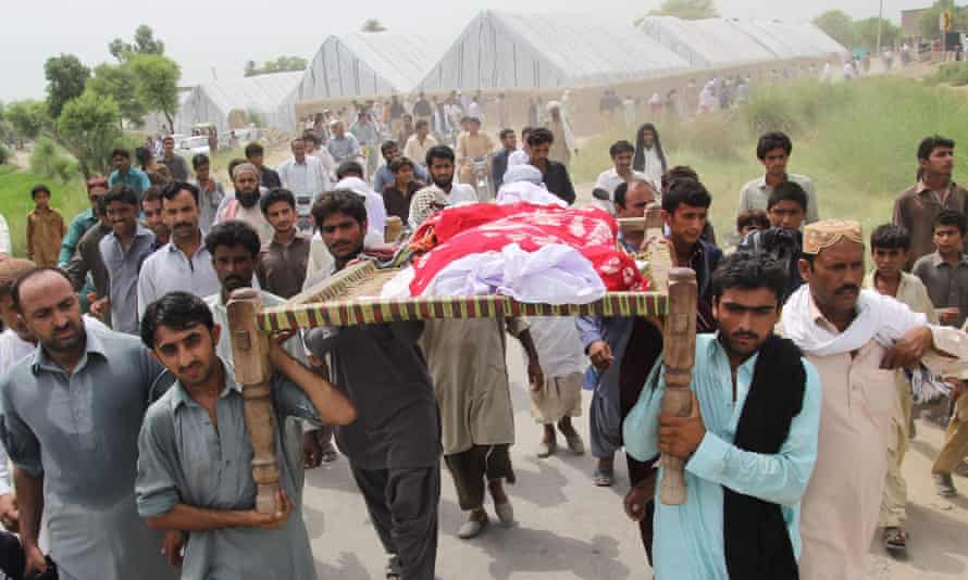 Male relatives and neighbours carry the body of social media celebrity, Qandeel Baloch during her funeral on July 17