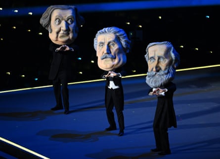 Actors dressed as the great masters of Italian opera, Verdi, Puccini and Rossini perform during the opening ceremony of the Winter Olympics in Milan.