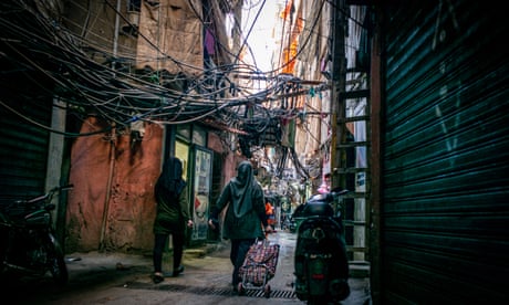 Women walking in an alleyway in The Shatila camp in southern Beirut, Lebanon.