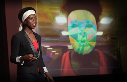 Joy Buolamwini giving a TED talk on her research into the biases of AI facial recognition.