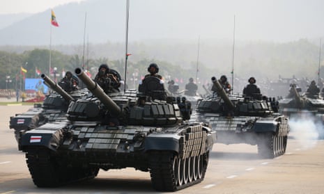 Military vehicles march in a formation during a  parade to mark Armed Forces Day in Nay Pyi Taw, capital of Myanmar, last month. 