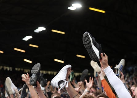 Leeds fans hold their trainers up in the air for a rendition of ‘Shoes off if you hate Man U’ during their match against Manchester City at Elland Road