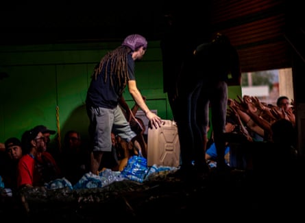 People ask to receive supplies after Hurricane Maria struck Puerto Rico in 2017.