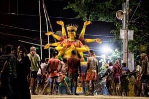 Statues, made from bamboo, straw and clay from the Ganges are immersed back into the river, completing a full circle at the end of the festivities. Before the immersions, there are huge processions from the place of worship to the river. Bearing in mind the effects of river pollution, the statues are removed by crane after the ceremonies.