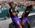 Lamine Yamal sits on the advertising board after opening the scoring against Real Betis.