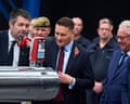 Wes Streeting looks at a gadget on the end of a thick tube of metal