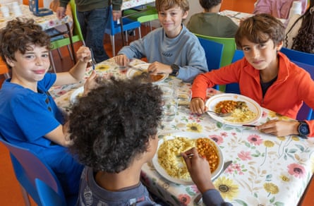 Schoolchildren enjoying their vegan lunch at a primary school