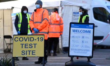 covid testing centre with people in hi-vis jackets