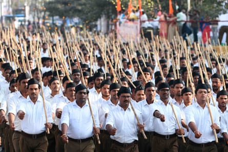Several thousand baton-wielding volunteers from Hindu hardline group the RSS march.