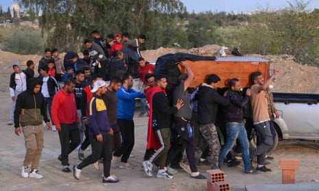 Mourners carrying the coffin of Nizar Issaoui during his funeral in the village of Haffouz.