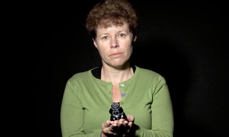 Claire Dwyer holding a Canadian Inuit carving of a woman, which she kept in her office for 20 years.